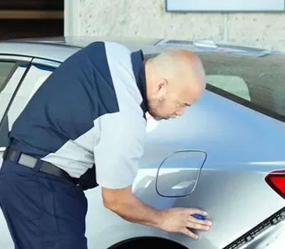 Repair specialist near a car